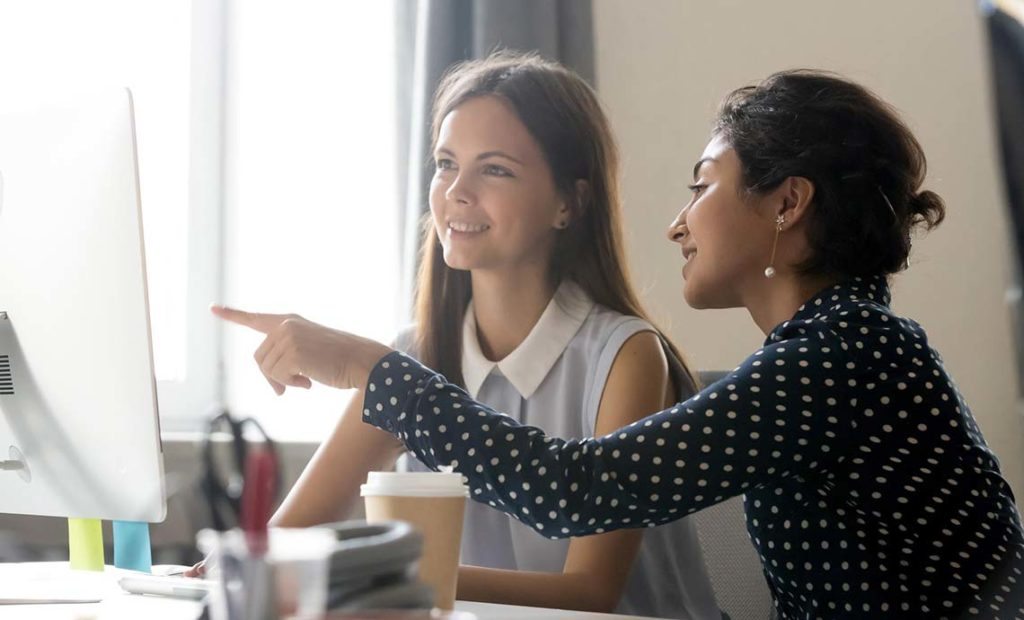 Intern and Mentor at a Computer