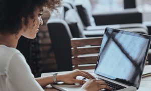 Women typing on her laptop